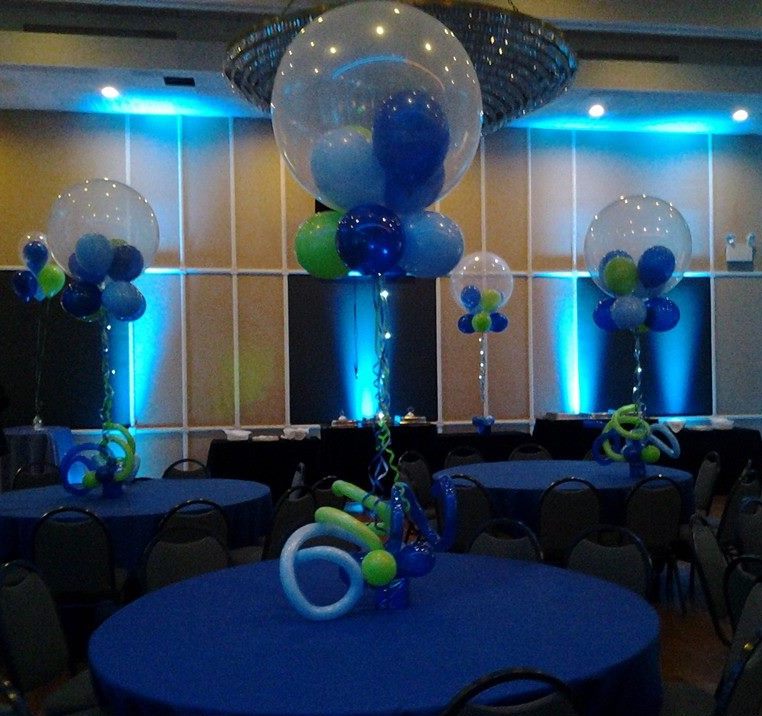 36 Inch clear hot air balloon centerpiece with curly Q balloons at the with colorful latex inside and on the bottom of the hot air balloon