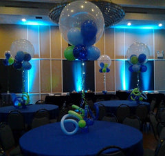36 Inch clear hot air balloon centerpiece with curly Q balloons at the with colorful latex inside and on the bottom of the hot air balloon