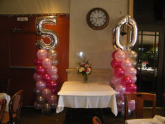 two 6 ft balloon columns with number 50 topper for milestone celebration and birthdays