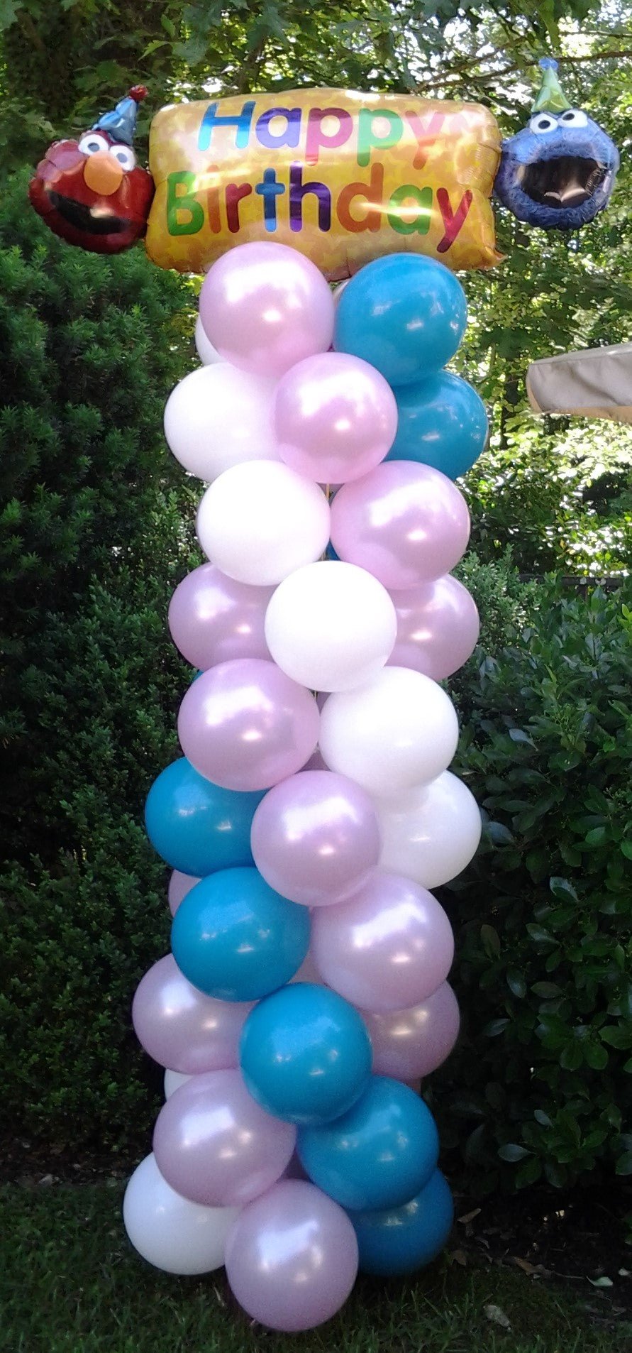 Colorful 8 FT balloon column with happy birthday mylar topper for party decor