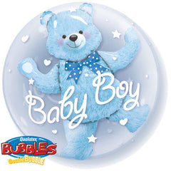 Festive baby boy table centerpiece with teddy bear in bubble and colorful latex balloons