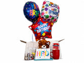 Balloon in a Box Trio Bouquet with three mylar happy birthday balloons, assorted mix candy, teddy bear, ceramic mug with hot chocolate mix and personalized greeting card