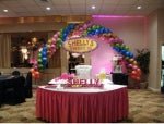 Sweet-themed balloon arch with colorful agate balloons and candy decorations