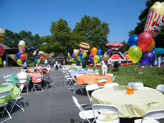 Colorful carnival balloon centerpiece with popcorn Mylar topper, festive party décor