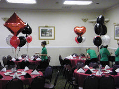 Casino balloon centerpiece with playing card mylar topper and black, red, white latex balloons