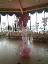 Cross sculpture balloon decor with large Mylar cross topper, vibrant latex balloons