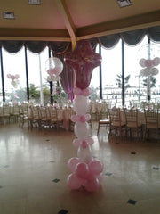 Cross sculpture balloon decor with large Mylar cross topper, vibrant latex balloons