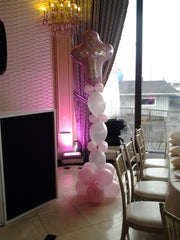 Elegant cross balloon sculpture with latex base and large Mylar cross topper