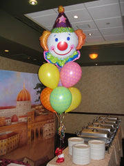Colorful circus balloon arrangement with clown mylar topper