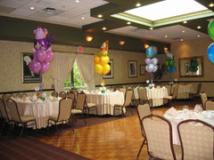 Circus-themed balloon centerpiece with 11 Inch colorful latex and Mylar topper