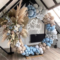 Colorful circle organic balloon backdrop with floral accent for event decor