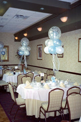 Fantasy Cloud Centerpiece with white, blue, and clear bubble balloons on foil weight