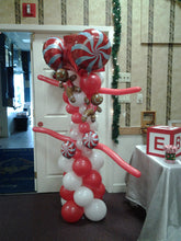 Gingerbread balloon column with candy accents and gingerbread man topper