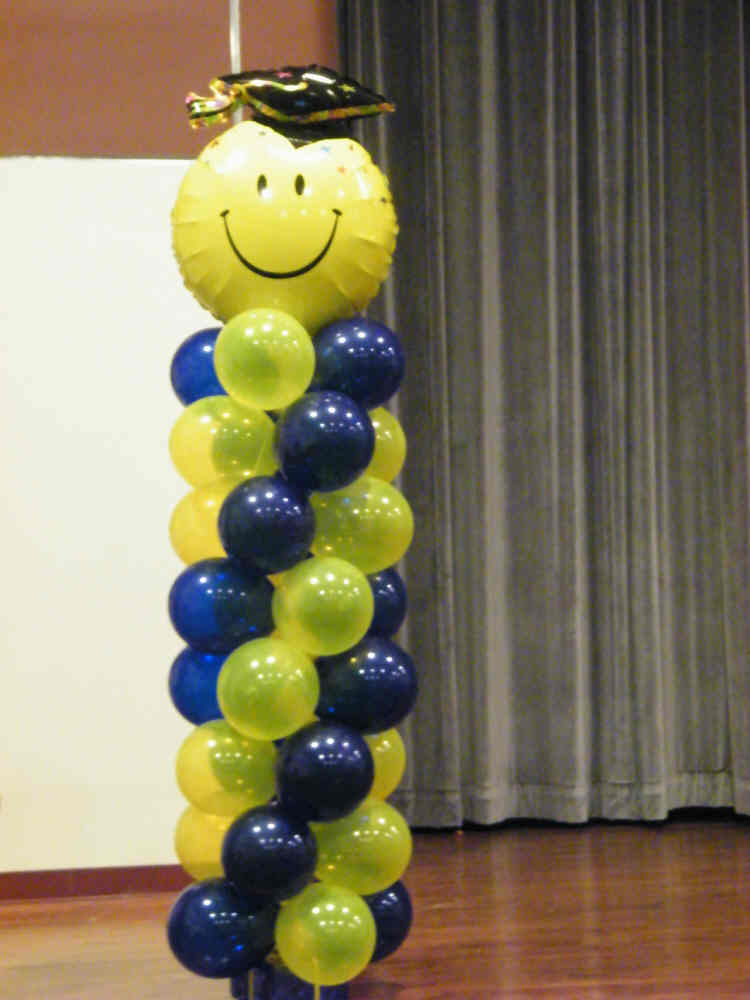 Smiley face graduation balloon column 8 FT tall with colorful balloons
