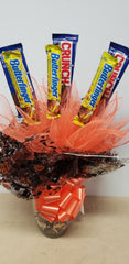 Halloween candy bouquet in keepsake glass jar with Crunch and Butterfinger candy bars and mini candy assortment