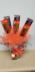 Halloween candy bouquet in keepsake glass jar with Hershey’s and Reese’s candy bars and mini candy assortment