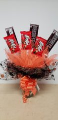 Halloween candy bouquet in keepsake glass jar with Hershey’s and KitKat candy bars and mini candy assortment