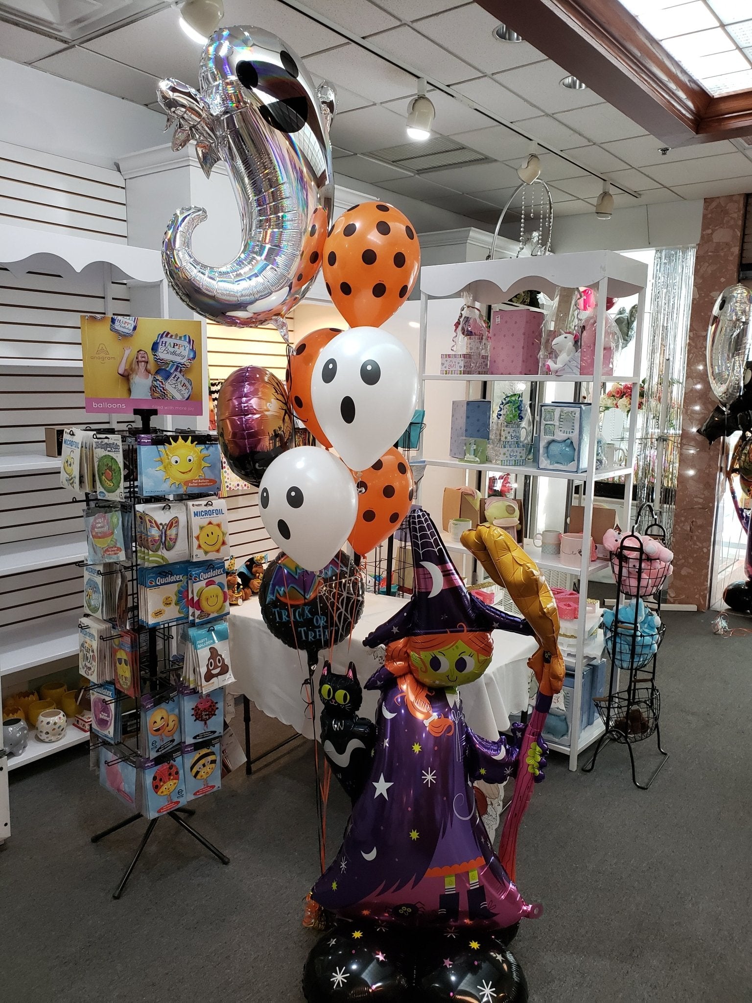 large halloween balloon bouquet with standing mylar and mixed latex balloons