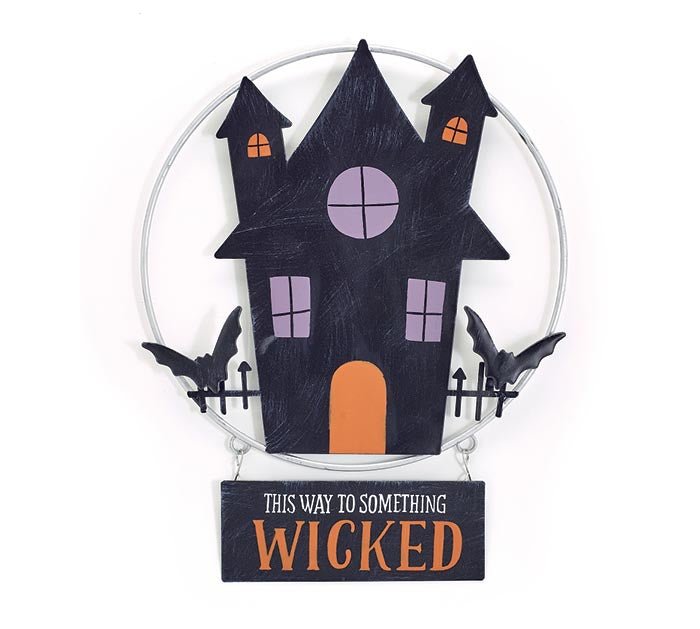 Set of 4 haunted house tin wall hangings with black house, purple and orange windows, orange door, bats, and “This way to something wicked” sign