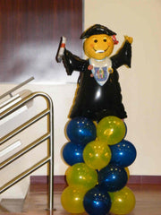 Graduation balloon column with colorful stacked balloons and large grad topper