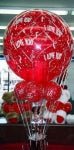 Valentine’s Day Love Is In The Air bouquet with 365 Hershey Kisses and solid red balloon on decorative weight