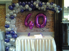 organic l shape balloon arch with number mylar centerpiece for birthday decor
