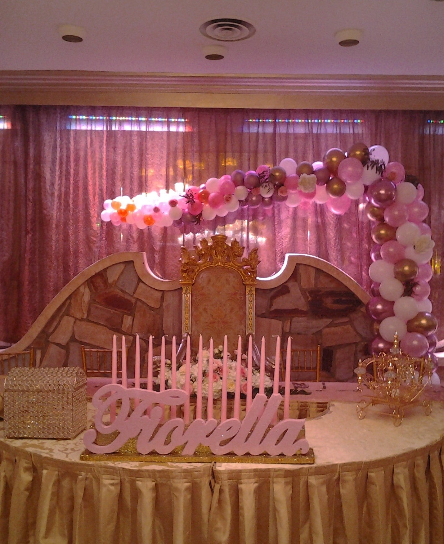 Colorful organic L-shape balloon arch with flowers for event decor