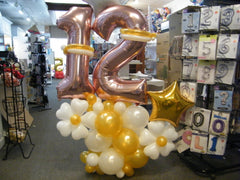 Organic mini balloon column with colorful latex and mylar balloons topped with number
