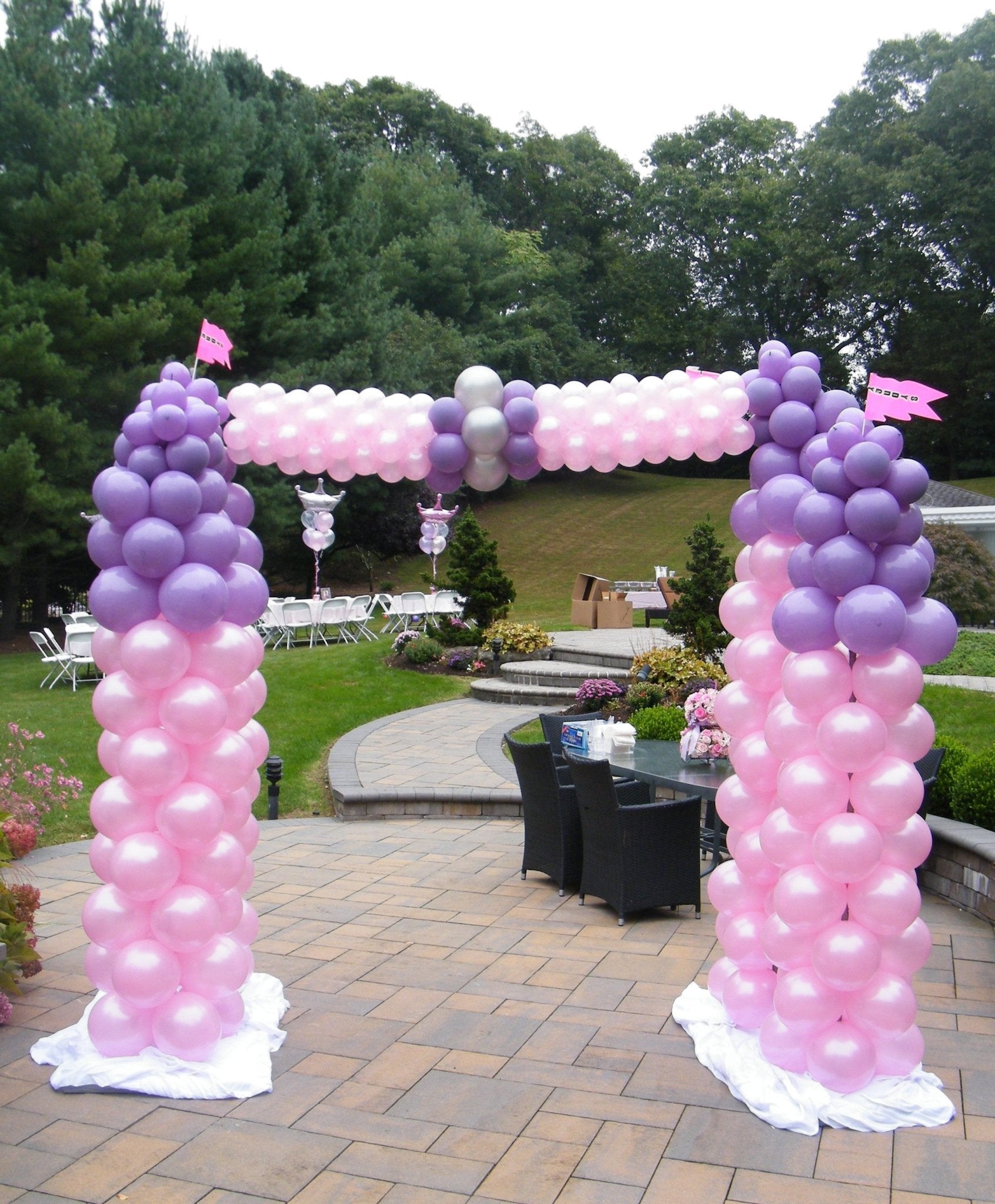 Princess Castle balloon sculpture in pink and purple latex with arch centerpiece