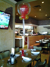 Large clear latex balloon with colored insert for race car themed centerpiece