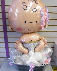 baby balloon centerpiece with pink and blue ribbon, white and clear latex base in keepsake tub