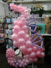 Colorful seahorse balloon sculpture, vibrant party décor