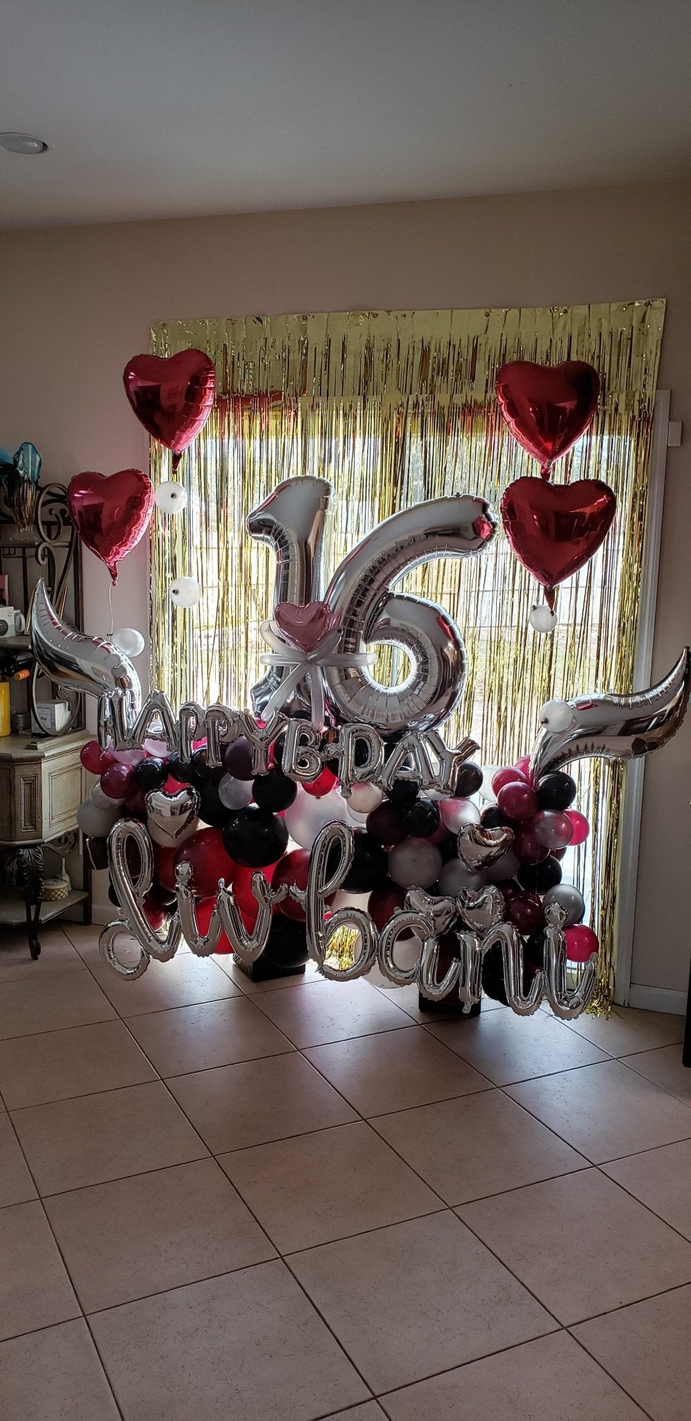 Sweet sixteen balloon backdrop with personalized name, colorful balloons, heart mylars