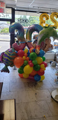 Tropical milestone birthday balloon bouquet with palm tree, fish, colorful balloons, and rainbow number balloons