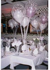 Colorful Tulle Time balloon centerpiece with polka dot and clear balloons on a weight