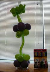 Colorful superhero balloon sculpture, vibrant party décor, fun and life-sized