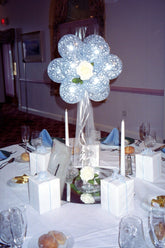 Victorian garden balloon centerpiece with 5 Inch latex balloons, silk rose, tulle, and ribbon on acrylic base