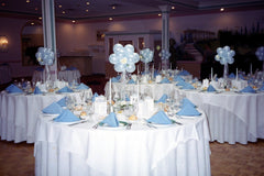 Colorful balloon centerpiece with 5 Inch latex balloons, silk rose, tulle, and ribbon for weddings and parties