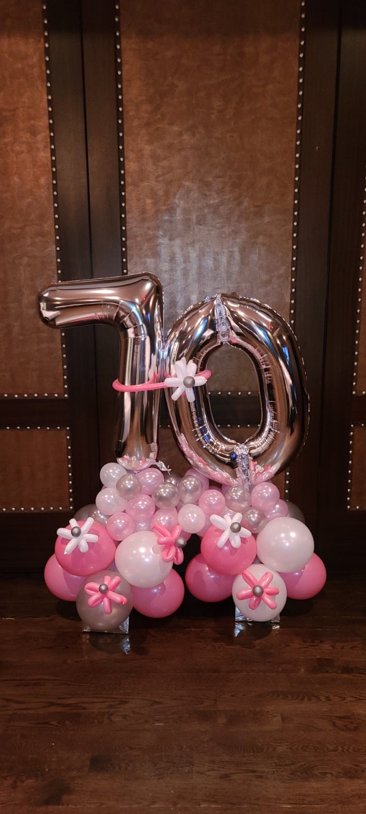 Milestone birthday balloon bouquet with large number balloons, colorful latex, and balloon flower accents