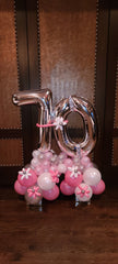 Milestone birthday balloon bouquet with large number balloons, colorful latex, and balloon flower accents