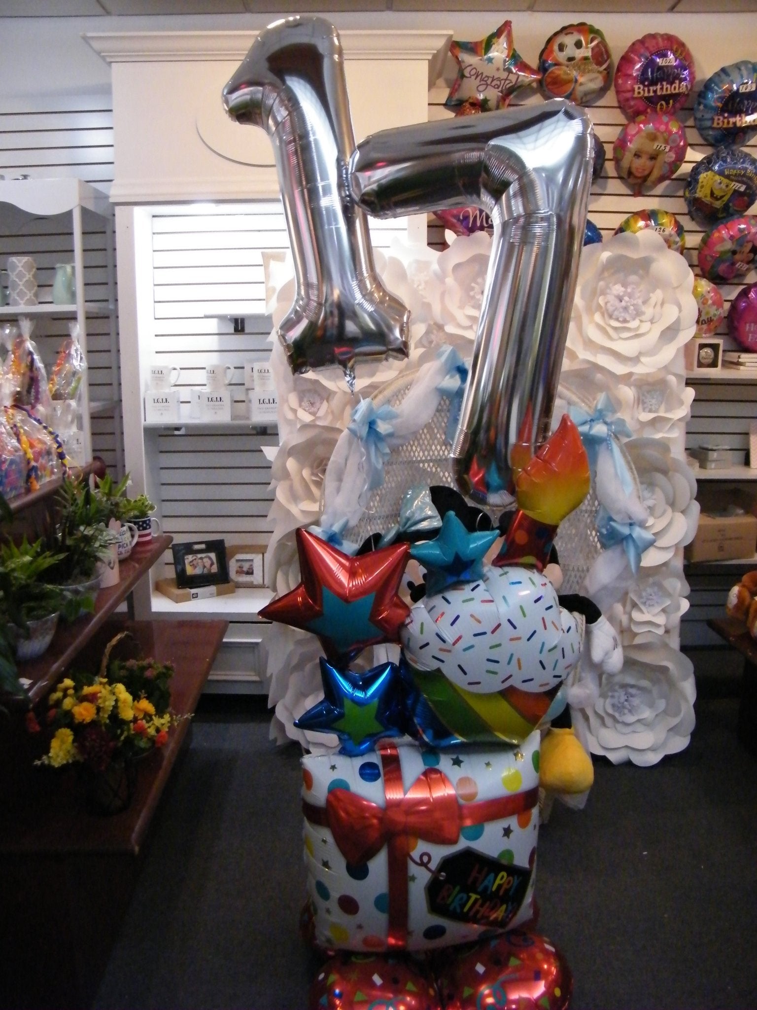 Birthday present balloon tower with large number balloons and stars