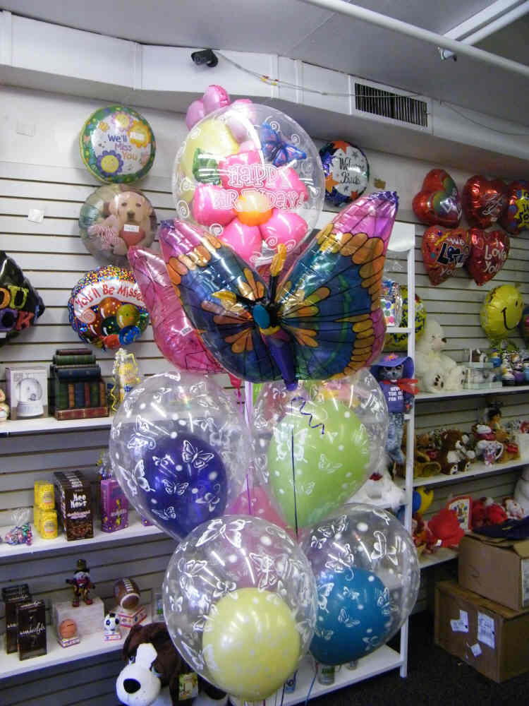 Butterfly Balloon Bouquet with butterfly mylars, latex bubbles, and customizable top balloon