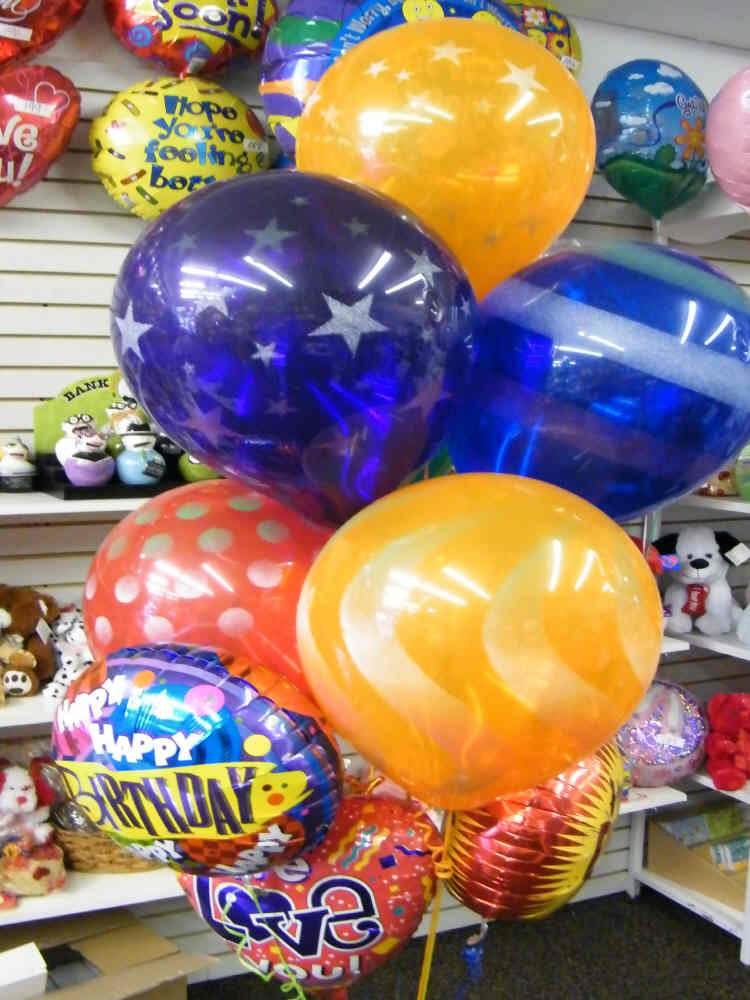 Colorful sprays and polka dot latex balloons with message mylar balloons