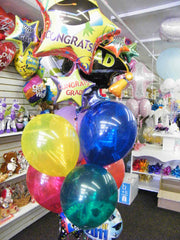 Super size graduate balloon bouquet with jumbo mylar balloons, latex balloons, and candy weight