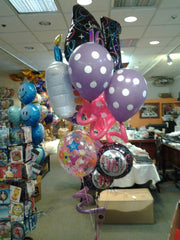 Sweet Sixteen balloon bouquet with jumbo Sweet 16 balloon, polka dot balloons, curly accents, rainbow cake balloon, and birthday mylars