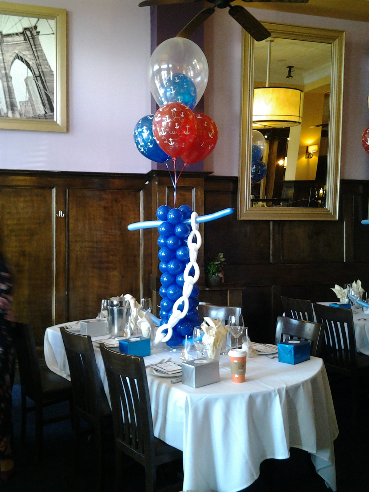 Anchor themed balloon centerpiece with large balloon anchor and latex balloons on top