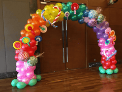 Colorful candy themed balloon arch with agate balloons and candy mylar accents