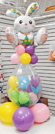 Easter Stuffed Surprise Balloon Bouquet with clear balloon, mini balloons, bunny topper, and candy