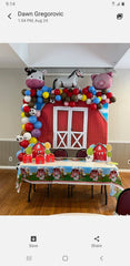 farm animal balloon arch with barn backdrop and colorful latex balloons