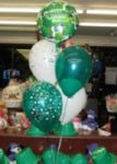 Close-up of Happy St. Paddy’s Day mylar balloon with latex balloons arranged as a party centerpiece